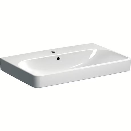Baltas keraminis pakabinamas praustuvas Geberit Smyle Square 75x48 cm su centrine anga pro maišytuvui