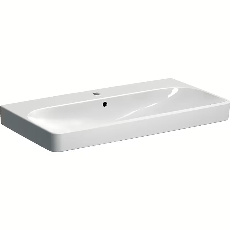 Baltas pakabinamas praustuvas Geberit Smyle Square 90x48 cm iš sanitarinės keramikos, su persipylimu ir anga pro maišytuvui.