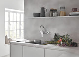 Grohe Eurosmart New svirtinis sieninė virtuvinis maišytuvas chromo spalvos su pasukamu snapu.