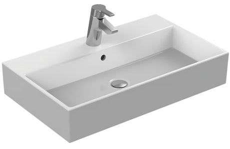 Baltas keraminis pakabinamas praustuvas Ideal Standard Strada 71x42 cm su anga pro maišytuvui per vidurį.