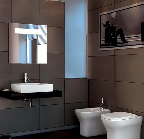 Baltas keraminis pakabinamas praustuvas Ideal Standard Strada 71x42 cm su anga pro maišytuvui per vidurį.