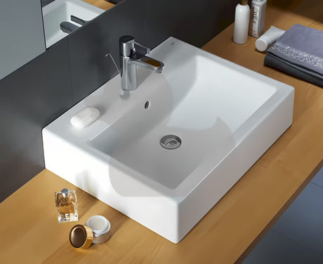 Baltas stačiakampis praustuvas Kolo Twins 60x46 cm su centrine anga pro maišytuvui