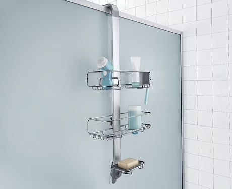 Dušo lentynėlė Simplehuman Shower caddy iš nerūdijančio plieno medžiagų su reguliuojamomis lentynėlėmis ir siurbtukais pro stabiliam tvirtinimui.