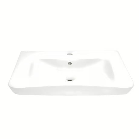 Baltas pakabinami neįgaliesiems praustuvas Vitra 65x56 cm iš keramikos su persipylimu ir anga pro maišytuvui centre.