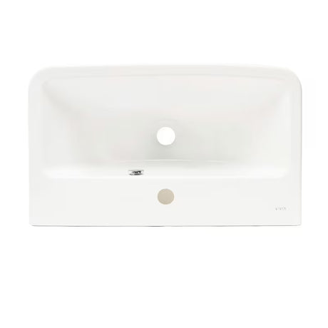 Baltas pakabinamas praustuvas Vitra Integra 60x36 cm, keraminis, su anga pro maišytuvui centre ir persipylimu.